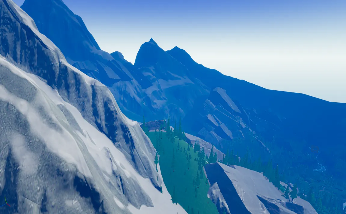 A snowy ridge looking out over a forested mountain range